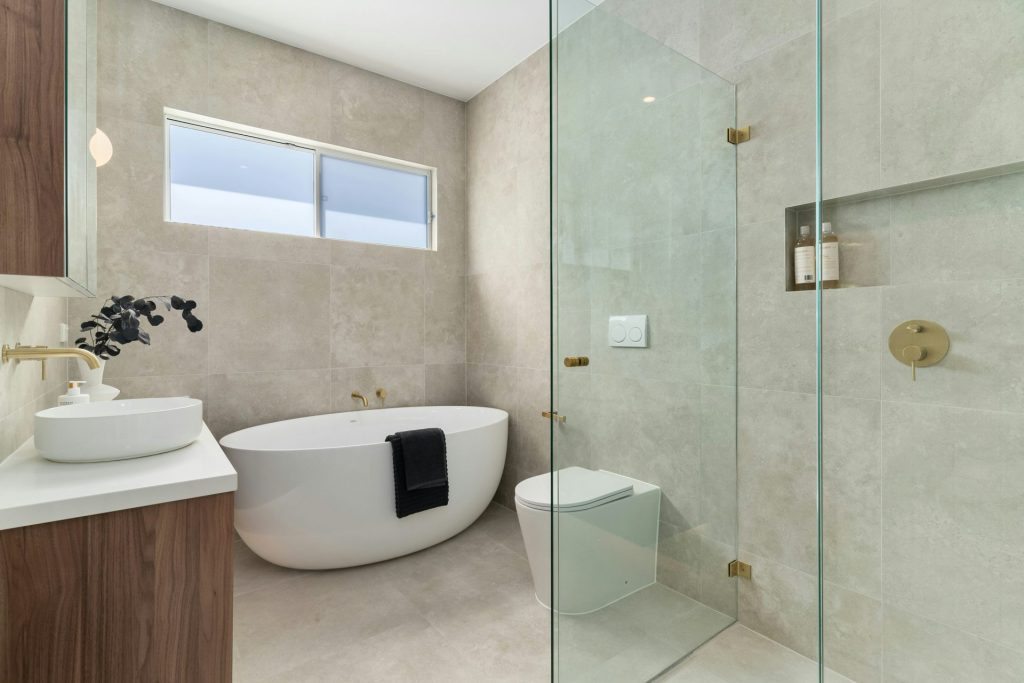 A bathroom with a tub, sink, and toilet